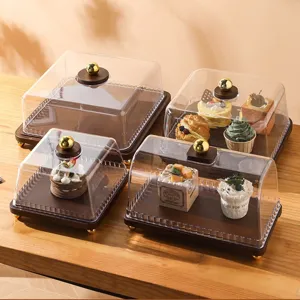 Retro wooden dessert display stand with clear cover and golden handle for wedding party.