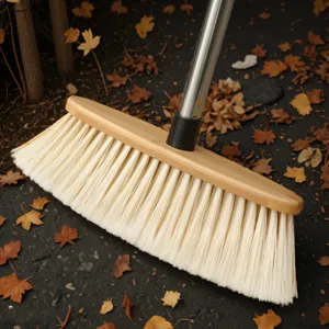 Wooden broom with soft bristles and stainless steel handle for floor cleaning and home use.