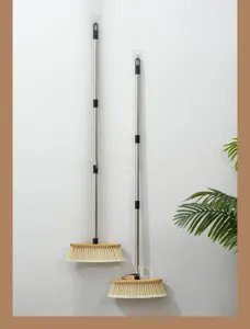 Household bamboo broom with stainless steel long handle and soft bristles for floor cleaning.