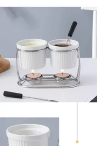 Ceramic fondue pot set detail, double bowls with metal stand and tea lights for melting.
