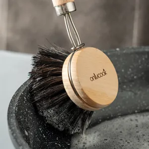 Wooden dish brush with stiff bristles for kitchen pot and pan cleaning, hanging design.