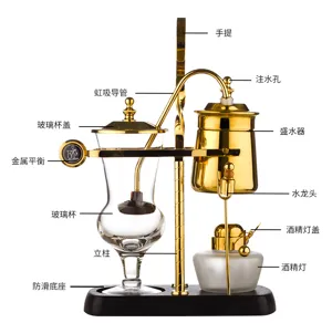 Stainless steel balance siphon coffee maker with gold metal stand and glass brewer for home.