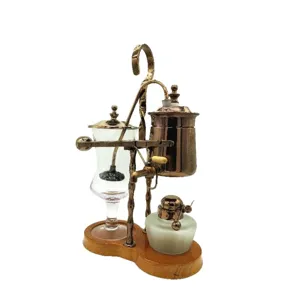 Balance siphon coffee maker vintage luxury brass and glass brewing pot with wooden base.
