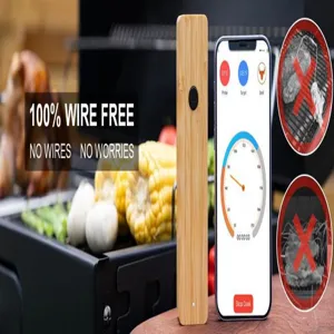 Wireless bluetooth meat thermometer detail showing bamboo charging base and app interface.