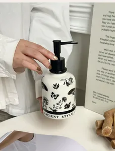 Ceramic soap dispenser bottle with Chinese style floral pattern for bathroom lotion and liquid soap.