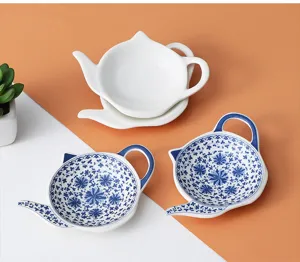 Ceramic teapot shaped tea bag dish set, blue and white floral snack and sauce plates.