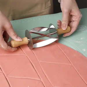 Stainless steel croissant roller cutter dough pastry cutting tool for baking kitchen.