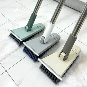 Long handle floor cleaning brush with stainless steel pole and scraping edge for bathroom tiles.