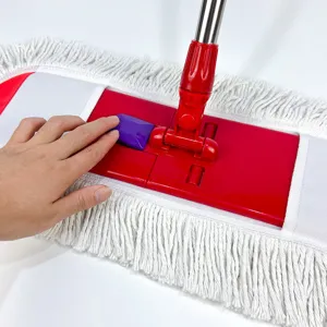 Close-up detail of flat dust mop head, red plastic base with press button and cotton fringe.