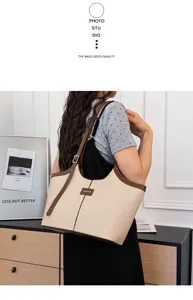 Detailed view of women casual canvas tote bag with brown leather trim and adjustable shoulder strap.