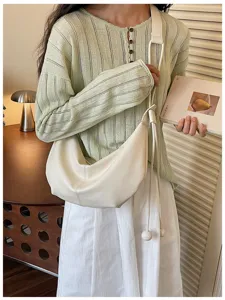 Stylish white leather slouchy shoulder bag for women, casual crescent dumpling crossbody purse.