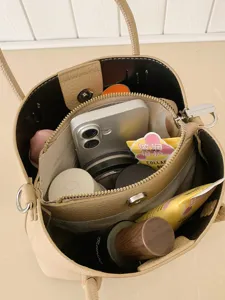 Stylish women's bucket bag with spacious interior design for daily commute and casual wear.
