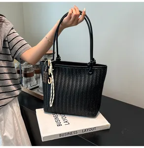 Chic black woven tote bag for women, stylish large capacity shoulder bag for daily use.