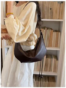 Trendy dark brown crescent shoulder bag, stylish hobo dumpling bag for women, chic crossbody purse.