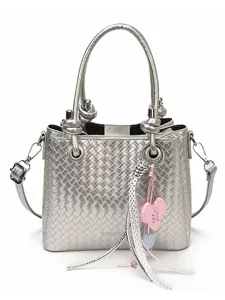 Silver woven leather bucket bag with top handles, crossbody strap and cute heart charm.