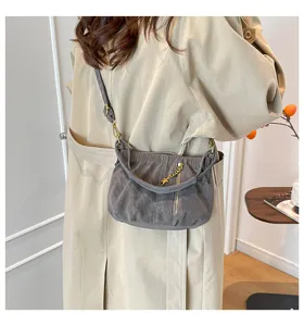 Stylish ruched shoulder bag for women, versatile crossbody commuter handbag with star charm.