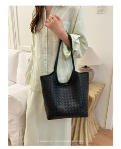 Minimalist black woven leather tote bag for women, large capacity stylish commuter bag.