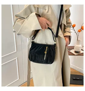 Chic black pleated shoulder bag with gold zipper and star pendant for women daily commute.