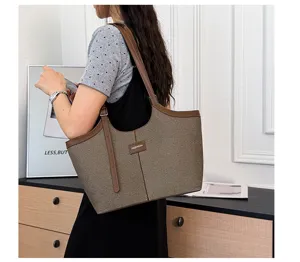 Detail view of women's commuter shoulder tote bag with spacious capacity and chic strap.