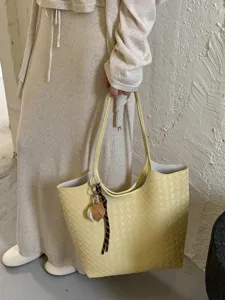 Minimalist retro yellow woven soft leather tote bag, large capacity stylish shoulder handbag.