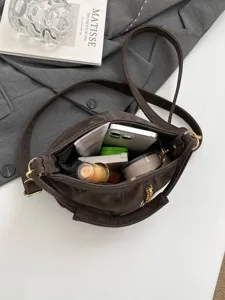 Dark brown vintage style shoulder crossbody bag with zipper and daily storage capacity.