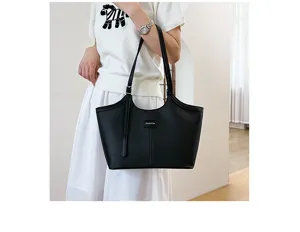 Detailed view of the stylish black leather tote bag, perfect for daily commute and capacity.