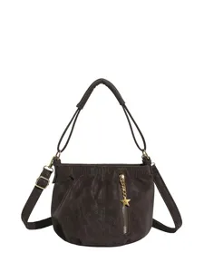 Stylish brown shoulder bag for women, versatile crossbody purse with star charm and zipper.