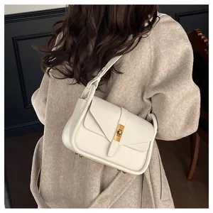 Chic minimalist leather shoulder bag for women, retro crossbody messenger bag with metal lock.