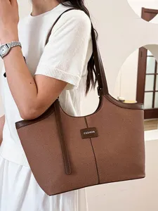 Brown large capacity commuter shoulder tote bag worn by model, daily stylish main view.