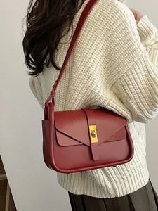 Vintage leather shoulder bag for women, retro messenger bag with gold lock and stylish design.