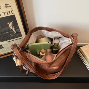 Vintage brown PU leather tote bag for women, large capacity casual commuter shoulder bag.