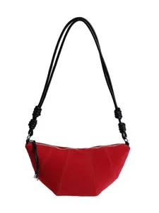 Red suede croissant shoulder bag for women, retro crescent crossbody bag with knotted straps.