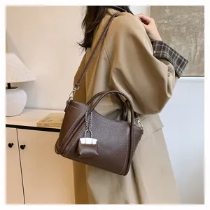 Stylish brown leather tote bag for women, versatile shoulder and crossbody bag for daily commute.