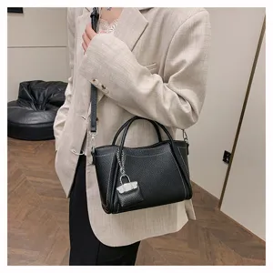 Black leather handbag with padlock charm, classic casual crossbody bag for women daily commute.