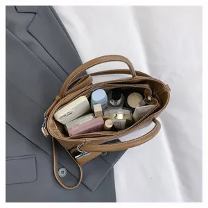 Large capacity brown tote bag top-down detail showing interior storage space for daily essentials.