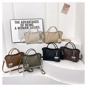 Stylish women's PU leather handbag with lock pendant, versatile casual crossbody bag.