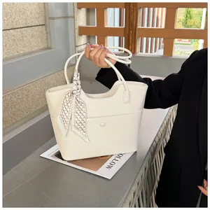 Large capacity casual tote bag for women, stylish commuting shoulder bag with scarf accessory.