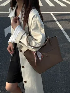 Large capacity brown leather tote bag for women, stylish casual commuting shoulder bag.