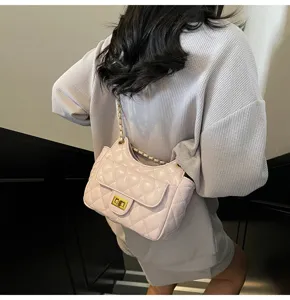 Chic quilted chain shoulder bag for women, stylish crossbody bag with metal lock.