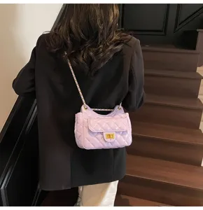 Quilted chain shoulder bag for women, purple chic messenger bag, elegant commuting bag.