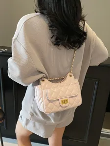 Stylish pink quilted chain shoulder bag for women, chic crossbody purse with turn-lock clasp.
