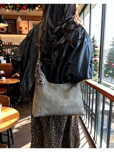 Retro casual women shoulder hobo bag in stylish cafe scene detail, perfect daily commuting.