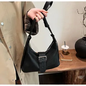 Black textured hobo shoulder bag with metal buckle, casual vintage commuter crossbody.