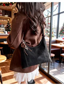 Women's retro black shoulder bag with white stitching, versatile stylish commuting daily bag.