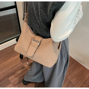 Stylish pleated shoulder bag with buckle strap, retro commuting hobo bag for daily wear and travel.