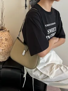French retro woven underarm bag for women, stylish spring saddle bag for versatile daily commute.