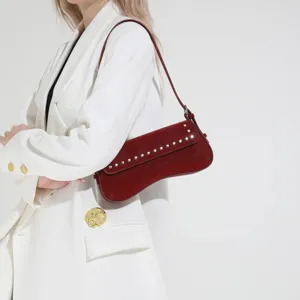 Retro rivet shoulder bag for women, chic crescent underarm bag, elegant daily commuter purse.