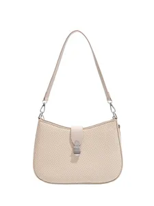 Classic retro beige underarm bag for women, stylish saddle shoulder bag for daily commuting.