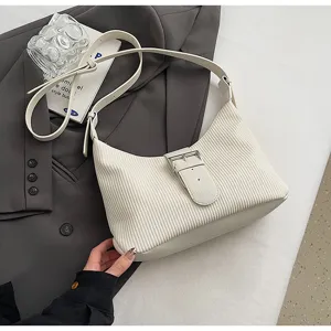 White textured underarm bag with metal buckle strap, vintage striped crossbody bag.