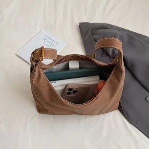 Vintage brown leather hobo shoulder bag for women, spacious casual daily tote handbag.